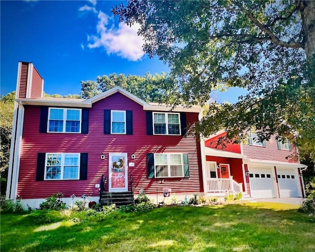 view of front of home featuring a front lawn and a garage