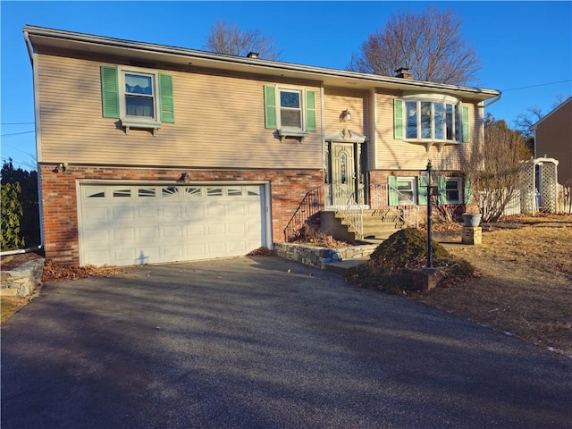 split foyer home featuring a garage