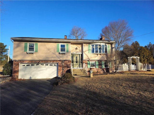 bi-level home featuring a garage