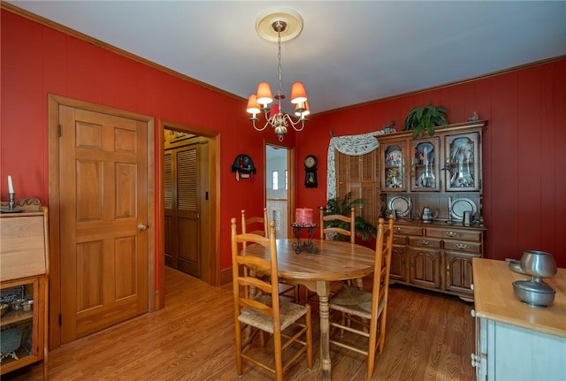 dining space featuring a chandelier and hardwood / wood-style flooring