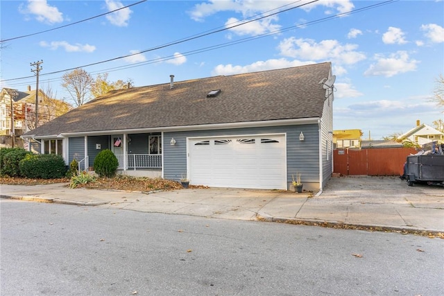 view of front facade with a porch and a garage