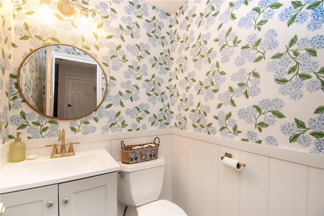 bathroom with toilet and vanity