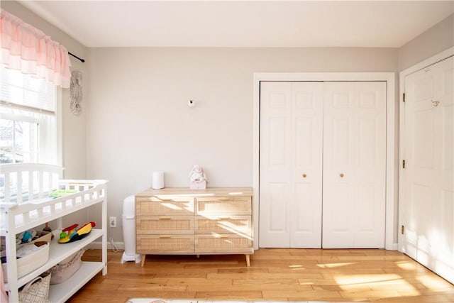 bedroom with hardwood / wood-style flooring and a closet