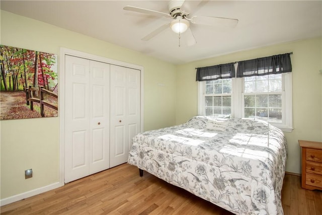 bedroom featuring ceiling fan, a closet, and light hardwood / wood-style floors