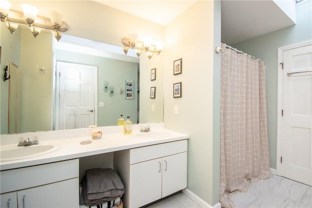 bathroom featuring walk in shower and vanity