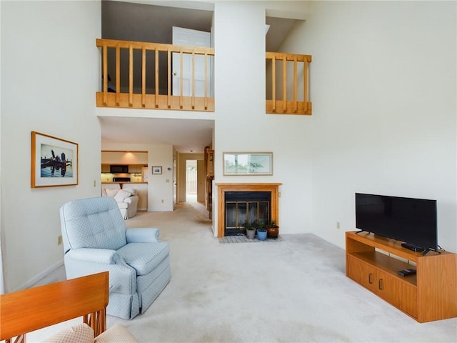 living room featuring light carpet and a high ceiling