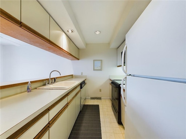 kitchen featuring white appliances and sink