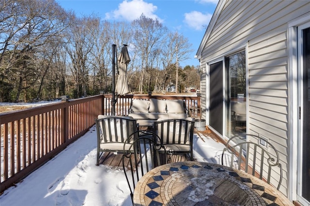 view of snow covered deck