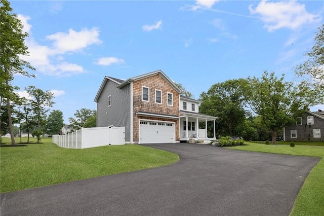 view of front of house with a front yard and a garage