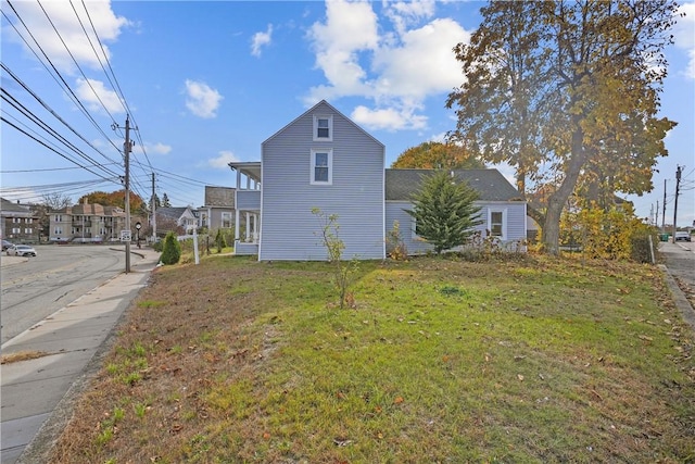 view of home's exterior featuring a lawn