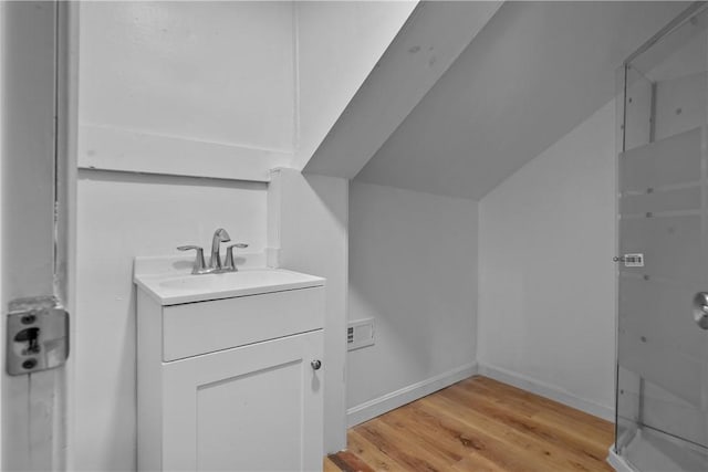 bathroom featuring vanity and hardwood / wood-style flooring