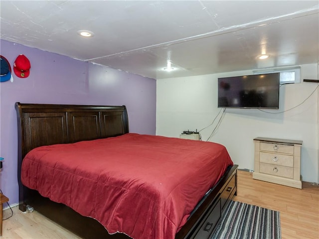 bedroom with light hardwood / wood-style flooring