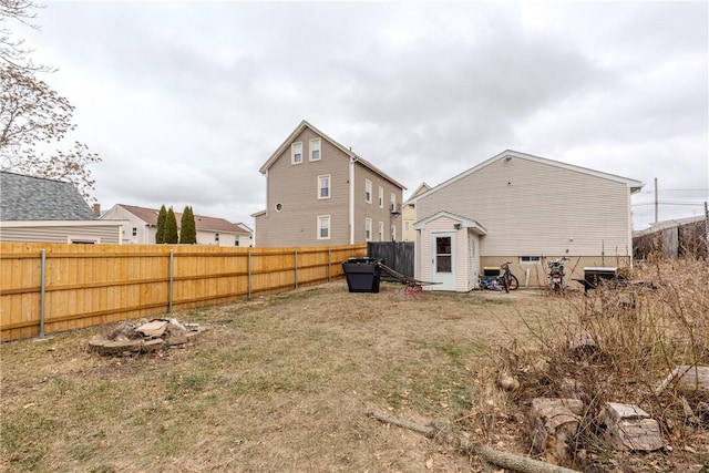 rear view of property featuring a lawn