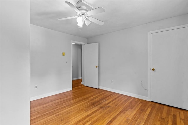 spare room with ceiling fan and light hardwood / wood-style flooring