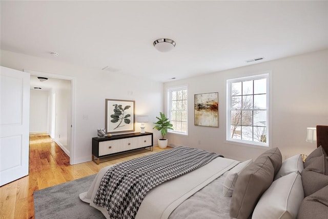 bedroom with light wood-type flooring