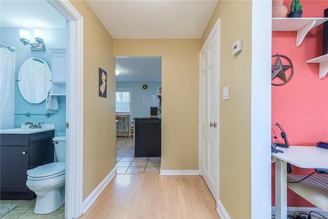 interior space with hardwood / wood-style floors and sink