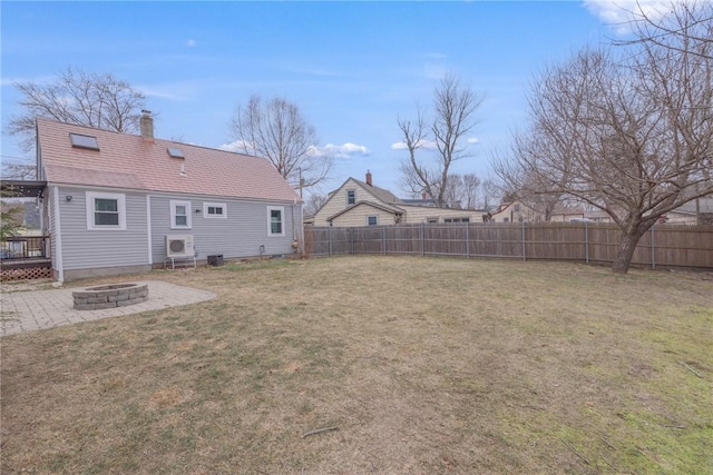 view of yard with a patio and an outdoor fire pit