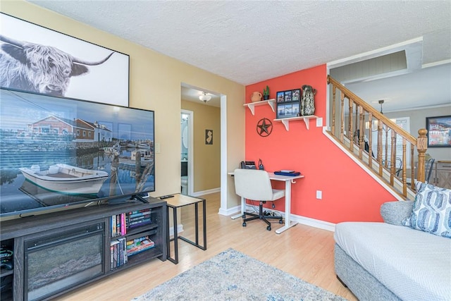 office area featuring hardwood / wood-style floors and a textured ceiling