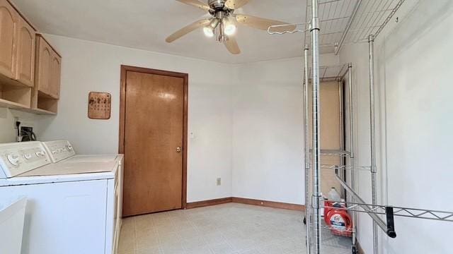 laundry area with cabinets, washing machine and dryer, sink, and ceiling fan