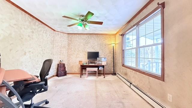 office featuring crown molding, ceiling fan, and a baseboard radiator