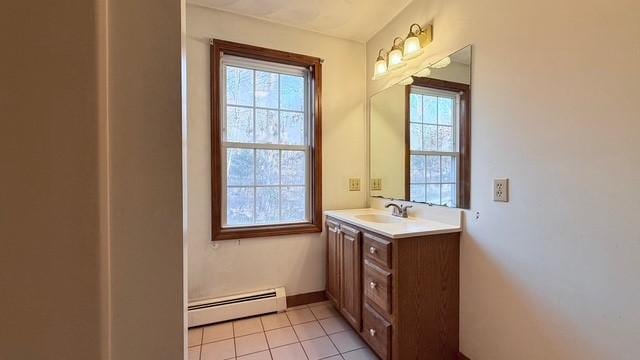 bathroom featuring vanity, tile patterned floors, and baseboard heating