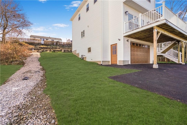 view of property exterior featuring a yard and a garage