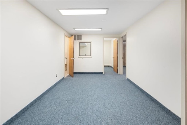 hall with carpet and baseboard heating