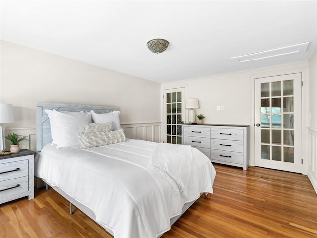 bedroom with hardwood / wood-style flooring