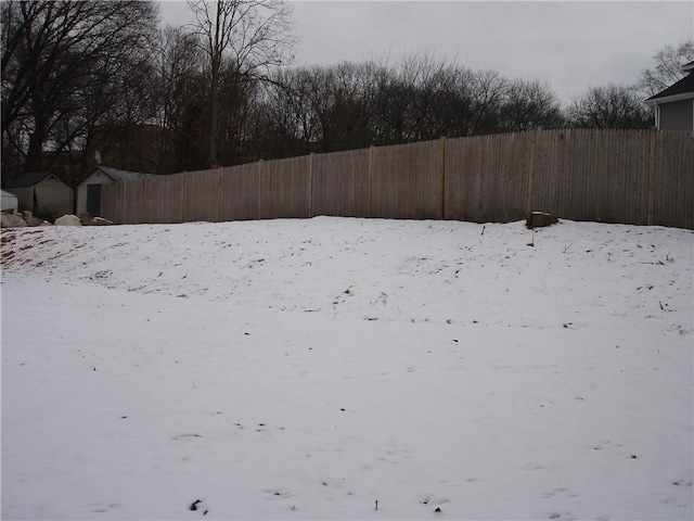 view of yard layered in snow