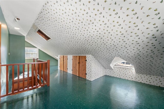 bonus room featuring vaulted ceiling