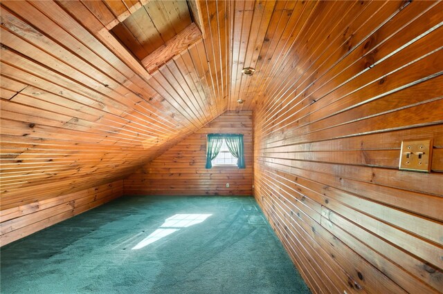 bonus room with lofted ceiling, carpet, wood walls, and wooden ceiling