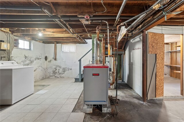 basement with washer / clothes dryer and water heater