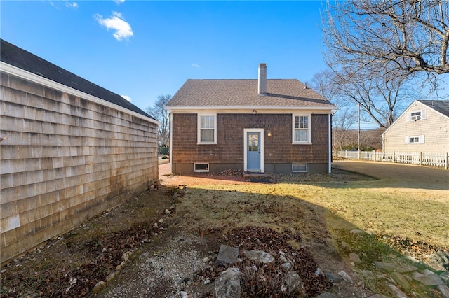 back of house featuring a lawn