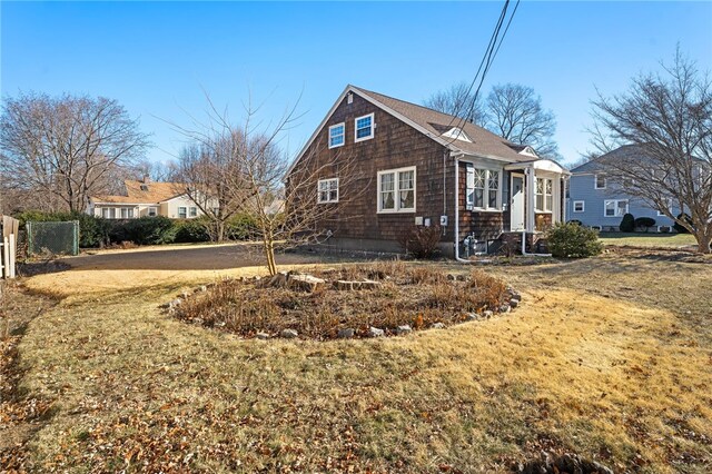 view of side of property featuring a yard