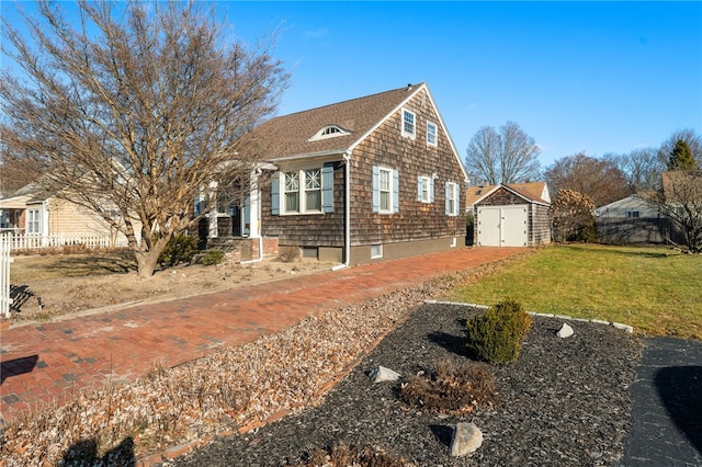 view of property exterior with a shed and a lawn