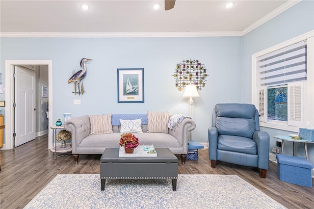 living room with ceiling fan, dark hardwood / wood-style flooring, and crown molding