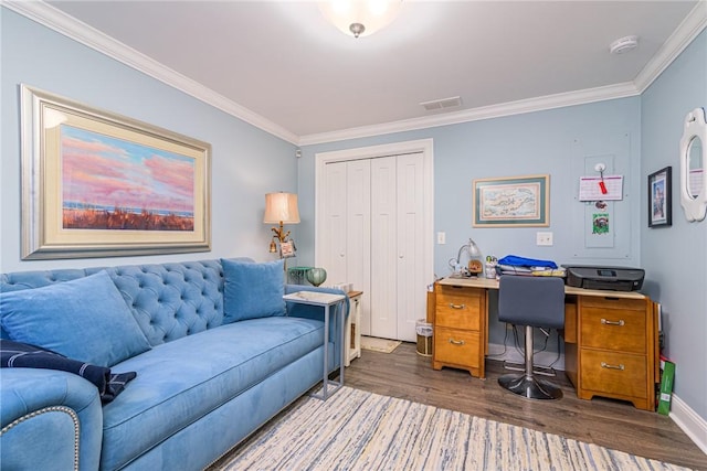 office area with ornamental molding and dark hardwood / wood-style flooring