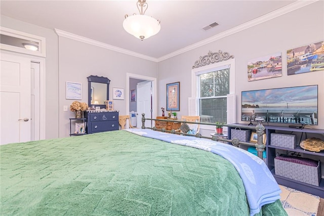 bedroom with crown molding