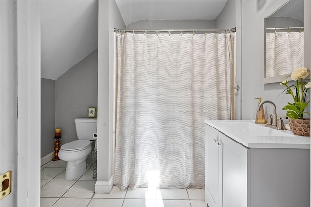 bathroom featuring curtained shower, tile patterned flooring, vaulted ceiling, toilet, and vanity