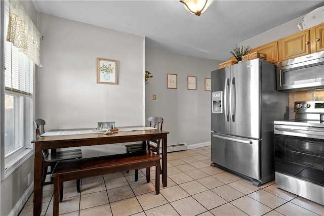 dining area featuring light tile patterned flooring