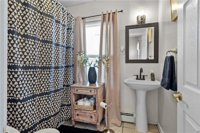 bathroom featuring tile patterned flooring and baseboard heating