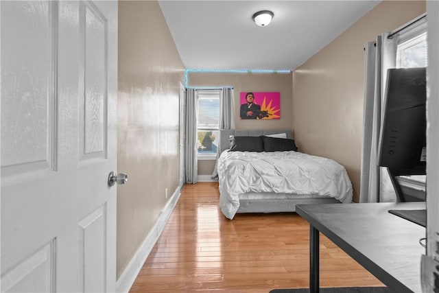 bedroom with hardwood / wood-style flooring