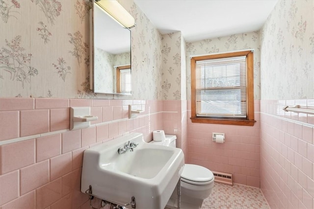 bathroom featuring tile patterned flooring, sink, a wealth of natural light, and toilet