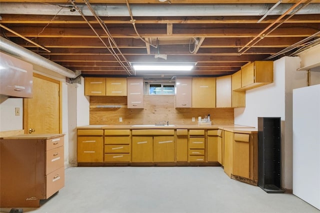 kitchen with sink and white fridge