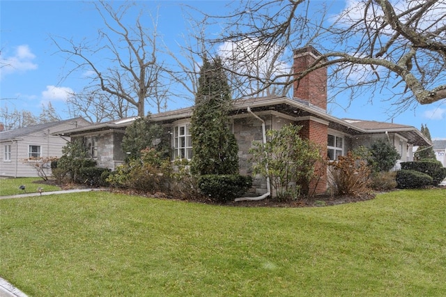 view of home's exterior with a yard