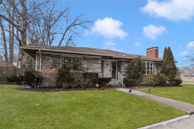 single story home featuring a front lawn