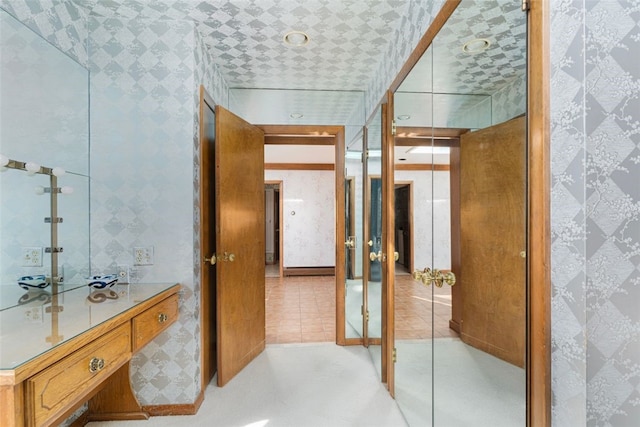 interior space featuring vanity and tile patterned floors