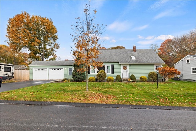 view of front of house featuring a front yard and a garage