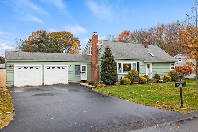 view of front facade featuring a front lawn and a garage