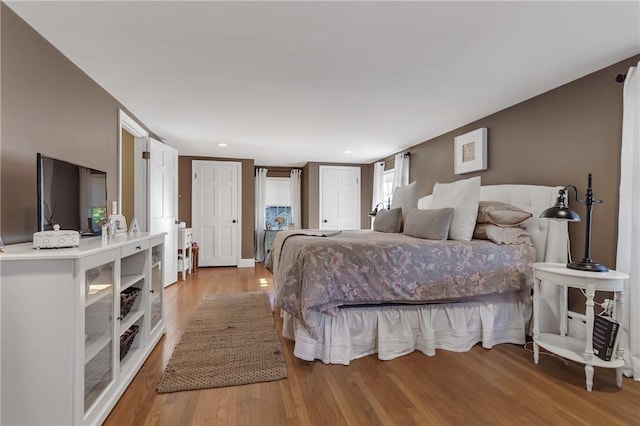 bedroom with light hardwood / wood-style floors